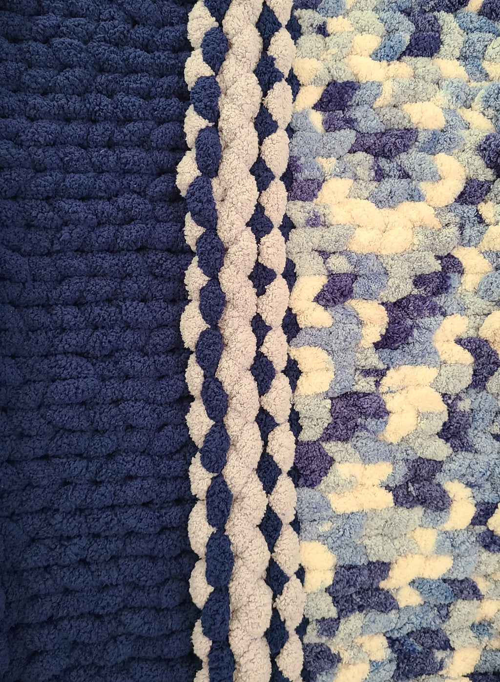 Winter Solstice — deep navy, light gray, and cream — close-up of the navy border against the mottled centre