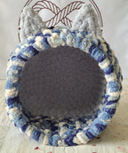 Snuggle Pod in Glacier Blue — navy, blue and cream chenille — front view with a soft grey cushioned floor
