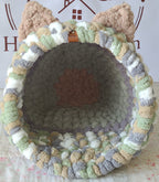 Snuggle Pod in Meadow Green — sage, cream and grey chenille — front view with a grey cushioned floor
