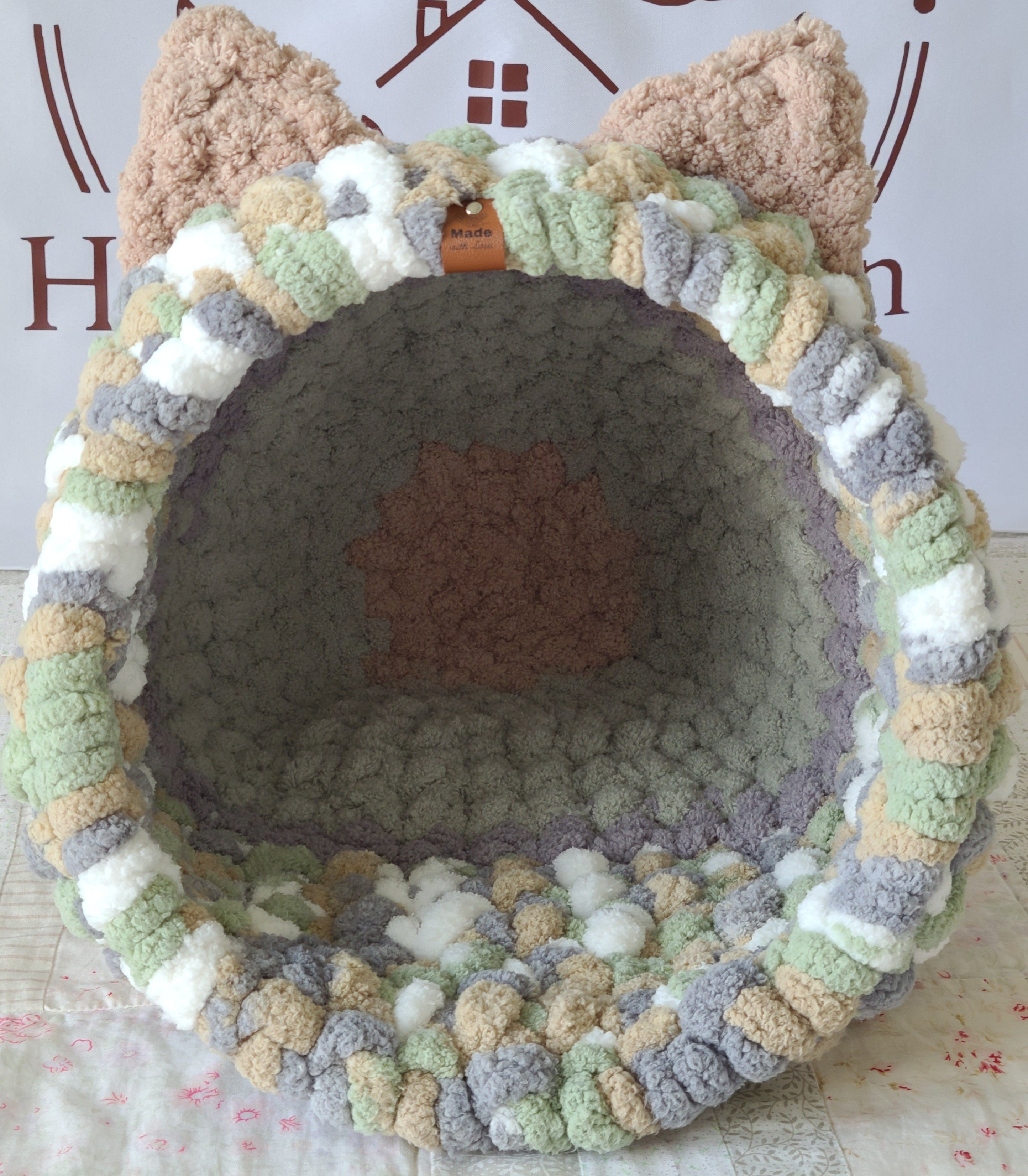 Snuggle Pod in Meadow Green — sage, cream and grey chenille — front view with a grey cushioned floor