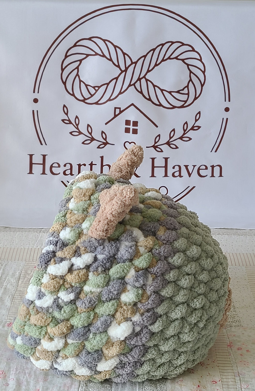 Snuggle Pod in Meadow Green — sage and cream chenille — side view showing the tan knit ears