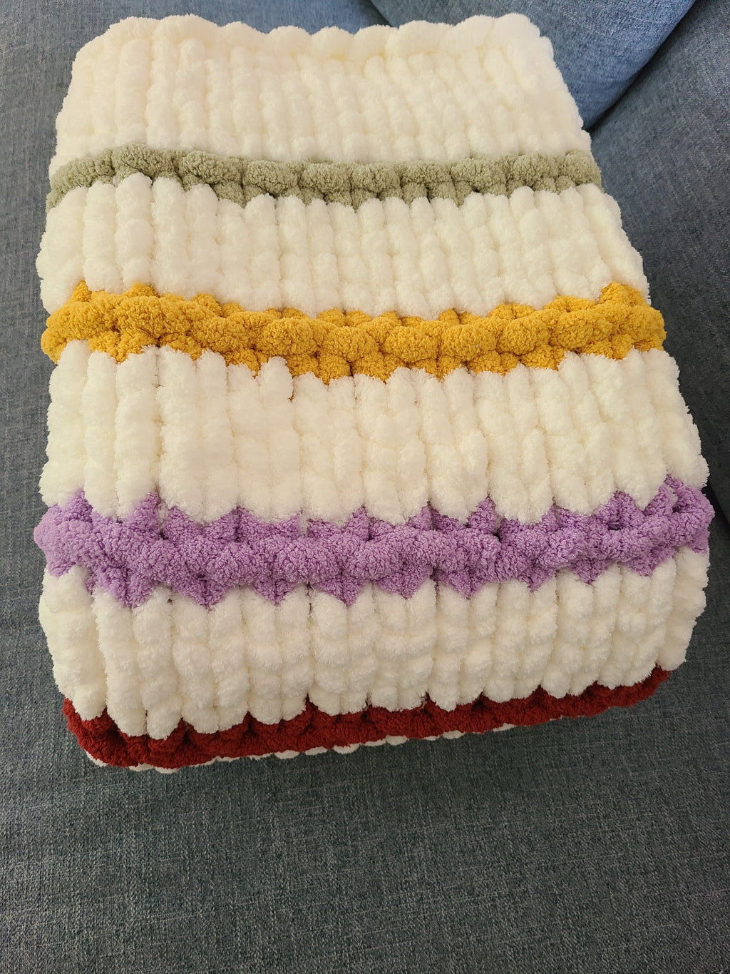 Timeless Eras — multicolour raised stripes on cream — folded detail of the sage, gold, and lavender ridges