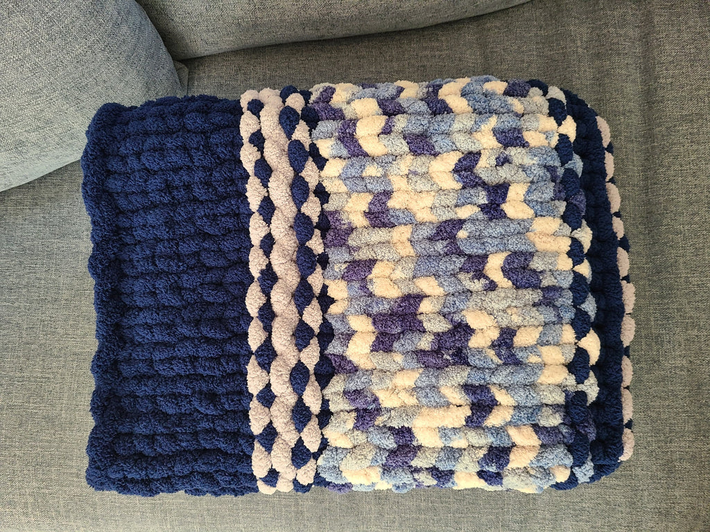 Winter Solstice — deep navy, light gray, and cream — folded detail of the navy band and variegated centre