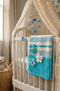 Cerulean Garden baby blanket — lake blue, aqua, and cream — folded flat with 3D flowers and striped pattern