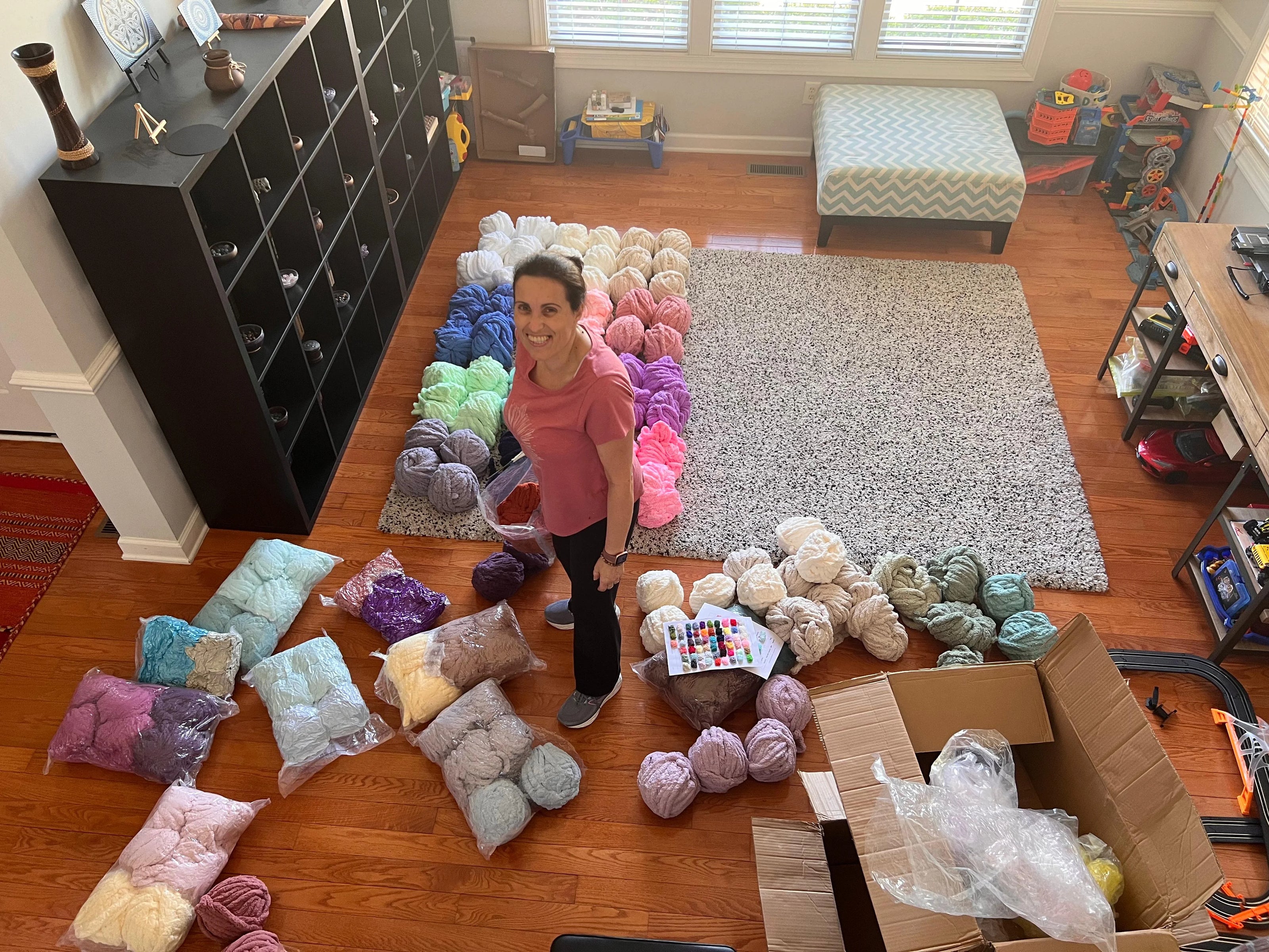 Sonia, founder of Hearth & Haven, knitting a chenille blanket in her North Carolina studio