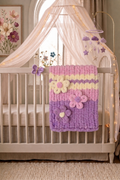 Wisteria Whisper baby blanket — deep purple and soft lavender — folded flat showing 3D floral texture